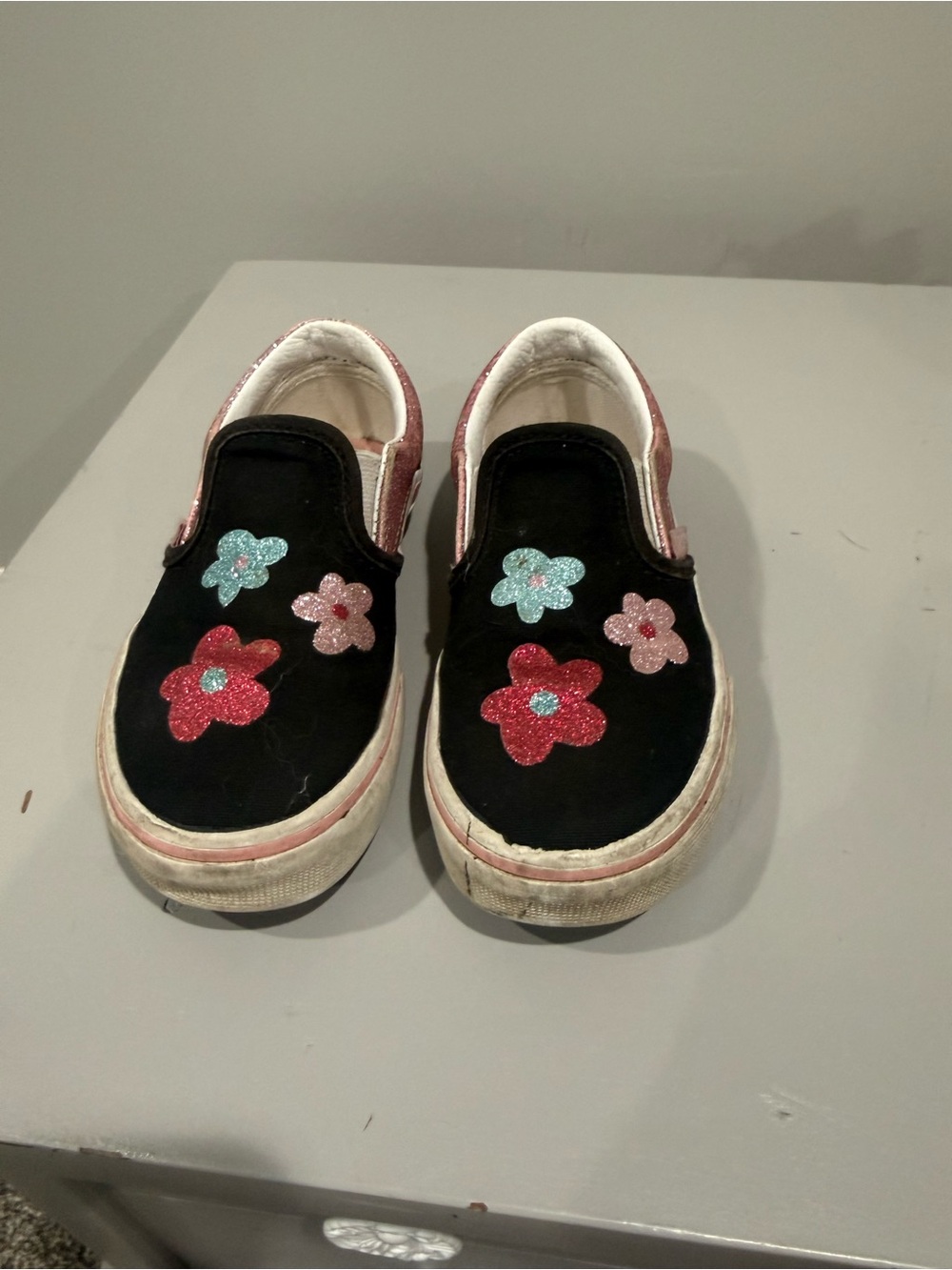 Vans Kids Black Slip-On Sneakers with Glitter Flower Appliqués